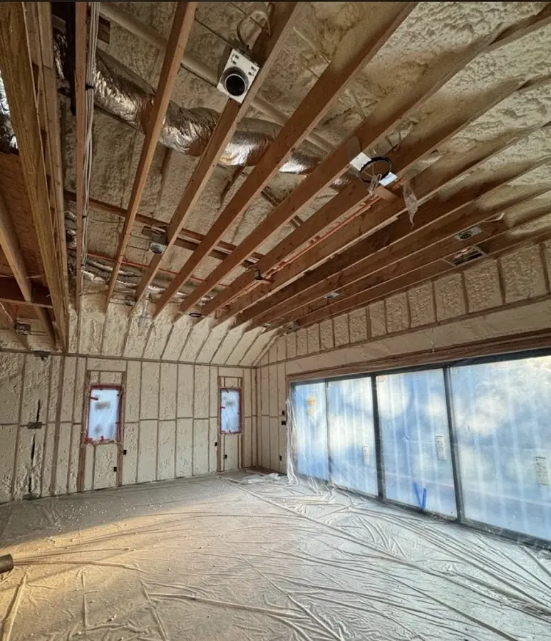 Interior walls and ceiling insulated with spray foam during new construction in Alvin